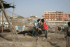 Fishermen Tending Equipment